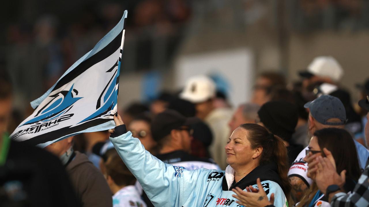 SYDNEY, AUSTRALIA - SEPTEMBER 03: Fans cheer during the round 27 NRL match between Cronulla Sharks and Canberra Raiders at PointsBet Stadium on September 03, 2023 in Sydney, Australia. (Photo by Jeremy Ng/Getty Images)