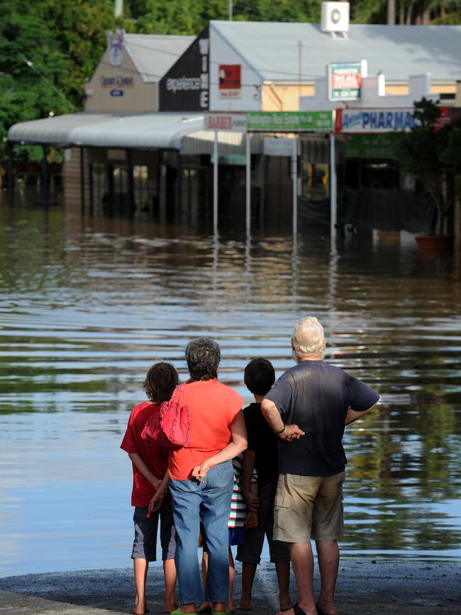 Residents and onlookers took to the streets in the inundated suburb of Rosalie in Brisbane on Thursday, January 13, 2011. By this time the flood waters had slowly started to recede.