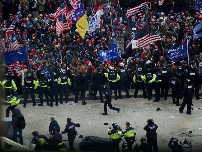 Police hold back supporters of US President Donald Trump as they gather outside the US Capitol's Rotunda on January 6, 2021, in Washington, DC. Picture: AFP