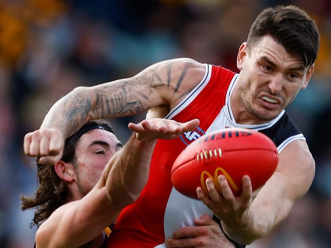 LAUNCESTON, AUSTRALIA - MAY 11: Josh Battle of the Saints is tackled by Jai Newcombe of the Hawks during the 2024 AFL Round 09 match between the Hawthorn Hawks and the St Kilda Saints at UTAS Stadium on May 11, 2024 in Launceston, Australia. (Photo by Michael Willson/AFL Photos via Getty Images)