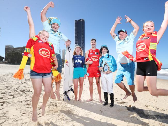 Primed for a big weekend of sport on the Gold Coast are from left, Suns fan Kayla Smith, Titans fan Michael Pulford,surfer Sierra Kerr, GC Suns player Alex Sexton, jockey Noel Callow, Titans fan Matthew Brown and Suns fan Bonnie Stott. Picture Glenn Hampson