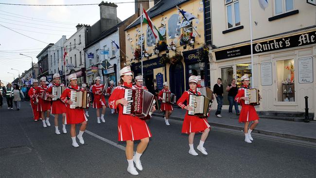 A marching band procession at the Fleadh Cheoil na hEireann Festival of Music in Tullamore, Ireland.