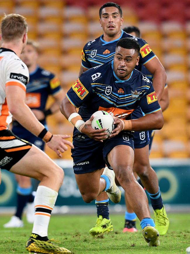 Sam Lisone of the Titans takes the ball up during the Round 4 NRL match between the Gold Coast Titans and the Wests Tigers at Suncorp Stadium in Brisbane, Sunday, June 7, 2020. (AAP Image/Dan Peled)