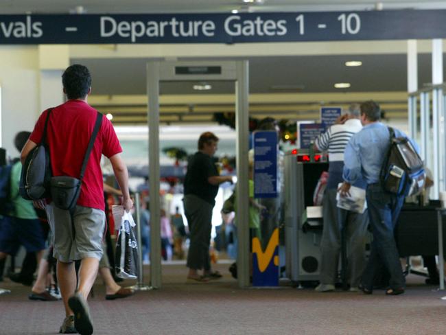 Passengers pass security at departure gates at Melbourne Airport. Picture: Brett Hartwig