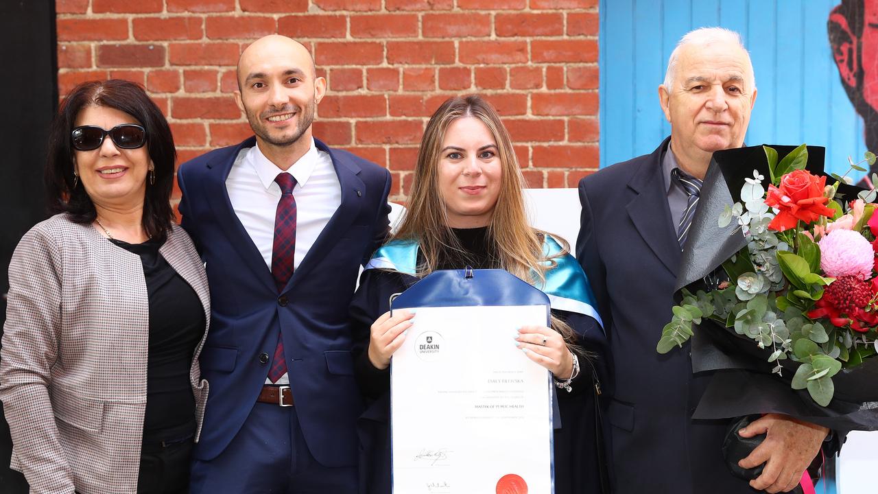 Deakin University graduate Emily Filovska with step mum Fanika Filovski, partner Petre Minchev and Stojan Filovski. Picture: Alison Wynd