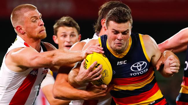 Brad Crouch of the Crows competes for the ball