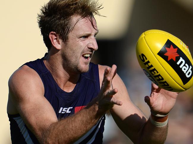 SPORT - NAB Challenge, Fremantle Dockers vs Richmond Tigers, Bendigo Bank Stadium, Mandurah. Photo by Daniel Wilkins. PICTURED- Fremantle's Michael Barlow gathers the ball