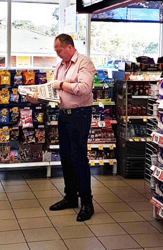 Barnaby Joyce reads the Daily Telegraph in a service station yesterday. Picture: Supplied