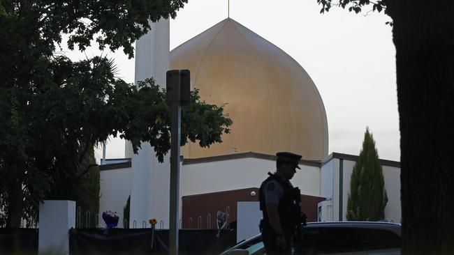 A police officer stands guard in front of the Al Noor mosque in Christchurch, New Zealand. Picture: AP 