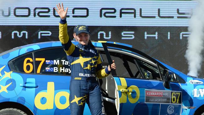 Molly Taylor celebrates on the podium during the Kennards Hire Rally Australia.