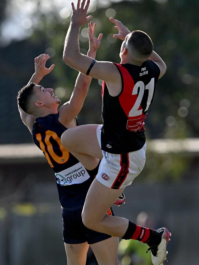 EDFL: Pascoe Vale’s Nick Parthenopoulos jumps over Zen Christofi of East Keilor. Picture: Andy Brownbill