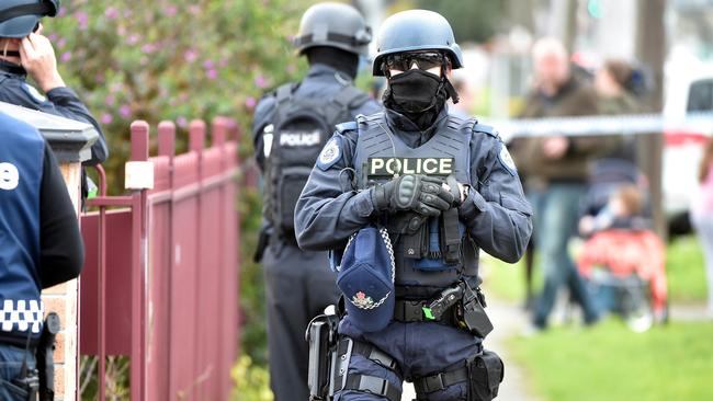 Police outside a house in Braybrook where a raid took place. Picture: Jay Town