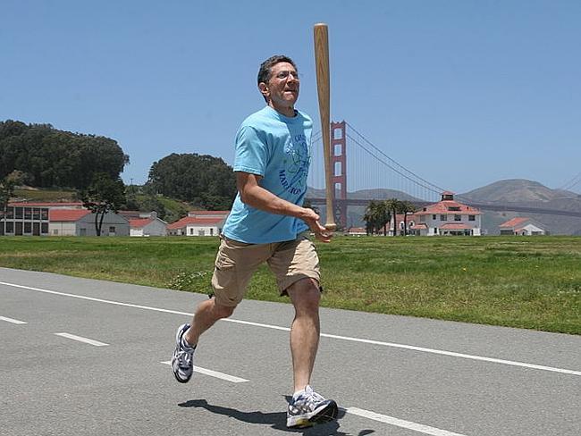 He balances a baseball bat on one finger. And runs for ages. 