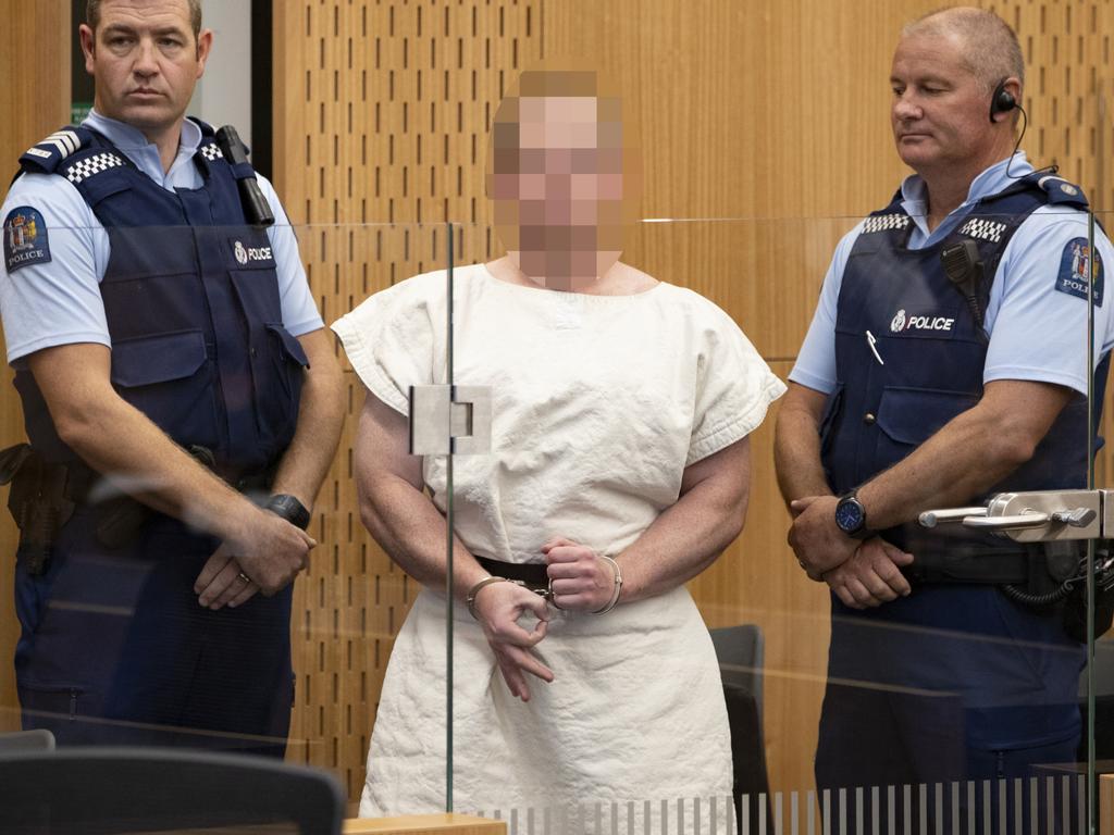 Brenton Tarrant making a sign to the camera during his appearance, for murder, in the Christchurch District Court. Picture: Mark Mitchell/NZ Herald