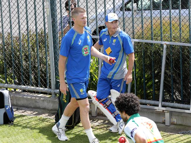 CRICKET: Wednesday 9th November 2016, Blundstone Arena: Australia’s Jackson Bird (left) and David Warner at training. Picture: LUKE BOWDEN