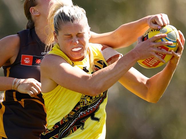 MELBOURNE, AUSTRALIA - NOVEMBER 03: Katie Brennan, Captain of the Tigers marks the ball during the 2024 AFLW Round 10 match between the Richmond Tigers and the Hawthorn Hawks at Swinburne Centre on November 03, 2024 in Melbourne, Australia. (Photo by Michael Willson/AFL Photos via Getty Images)