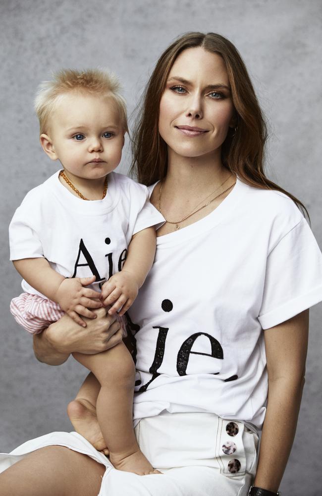 Seeing double! Model and photographer Ivana Martyn holding her son Winston, wearing matching Aje tees. Picture: Aje