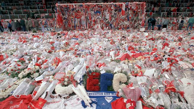 Floral tributes are placedat the 'Kop' end of Anfield Stadium in Liverpool.