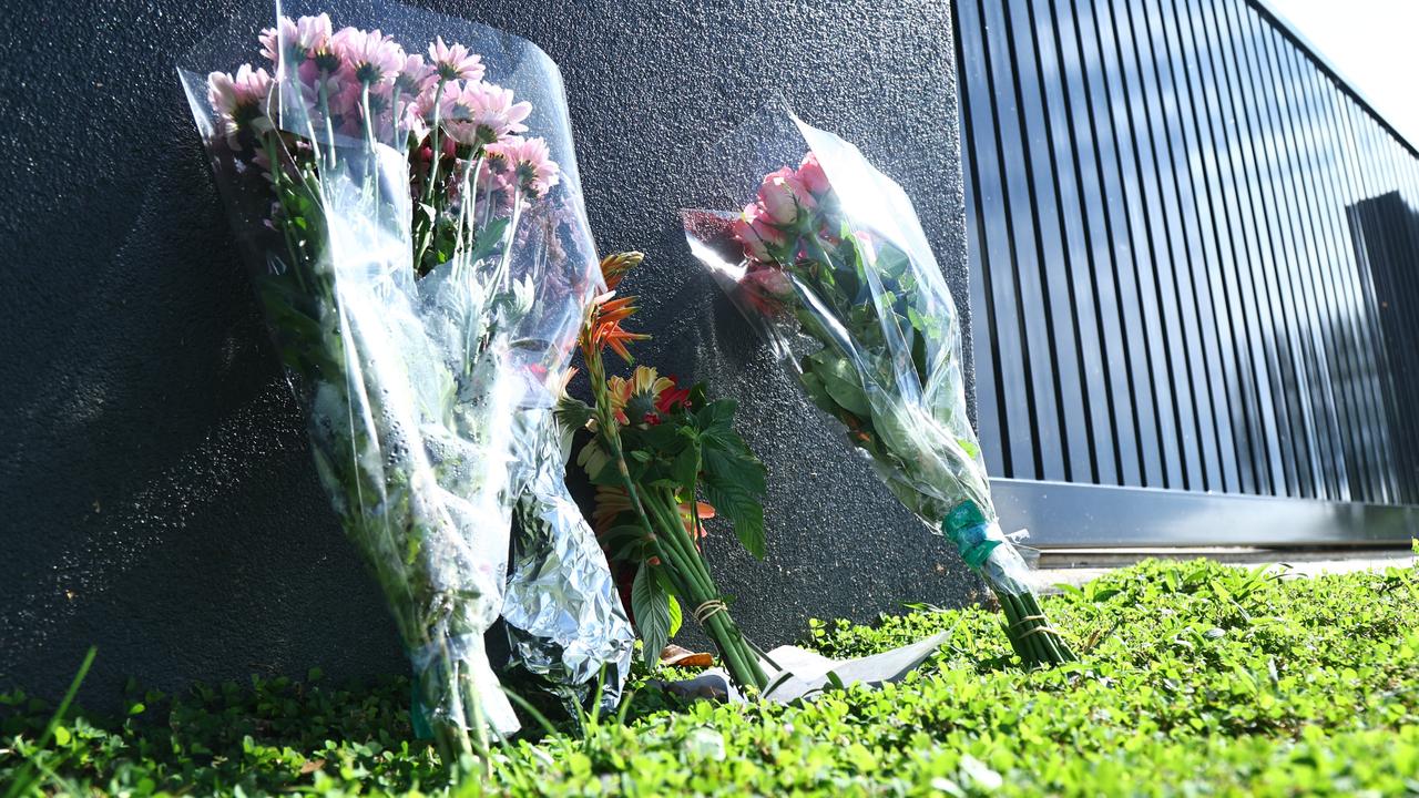 Neighbours of Jamie and Krystel Paul killed in a murder-suicide on Tuesday at Mount Sheridan laid floral tributes at the gate of the Verbena St property. Picture: Peter Carruthers