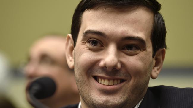 FILE - In this Feb. 4, 2016 file photo, Pharmaceutical chief Martin Shkreli smiles on Capitol Hill in Washington during the House Committee on Oversight and Reform Committee hearing on his former company's decision to raise the price of a lifesaving medicine. Shkreli announced on Twitter Sept. 26, 2016, that he would offer up a chance to punch him in the face as part of a fundraiser for the son of his former PR consultant, who recently died. (AP Photo/Susan Walsh, File)