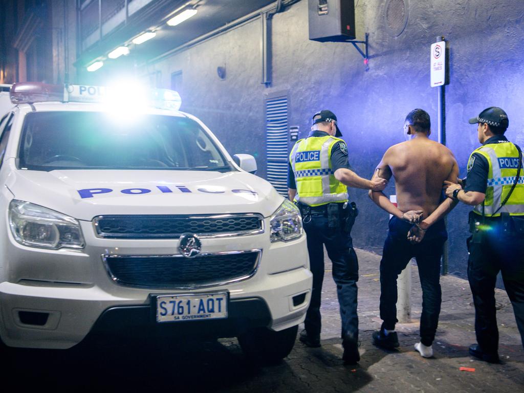 Police arrest a man in Hindley St just after midnight, New Year’s Day, 2020. Picture: AAP / Morgan Sette