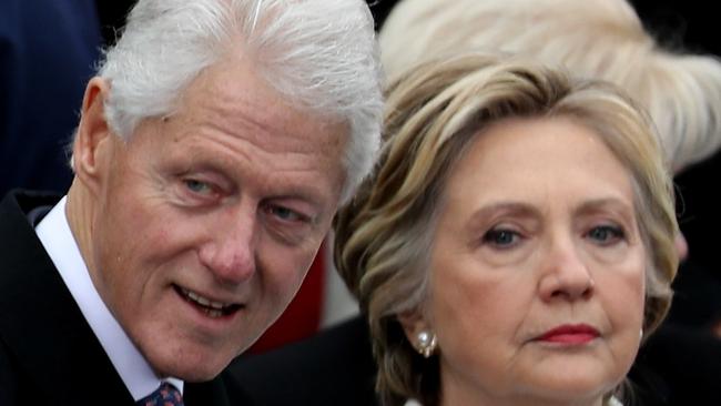 WASHINGTON, DC - JANUARY 20: Former President Bill Clinton and former Democratic presidential nominee Hillary Clinton stand on the West Front of the U.S. Capitol on January 20, 2017 in Washington, DC. In today's inauguration ceremony Donald J. Trump becomes the 45th president of the United States.   Joe Raedle/Getty Images/AFP == FOR NEWSPAPERS, INTERNET, TELCOS & TELEVISION USE ONLY ==