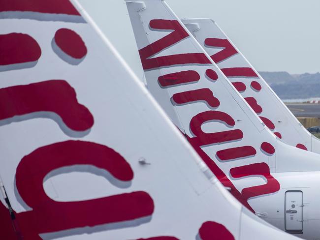 SYDNEY, AUSTRALIA - NewsWire Photos FEBRUARY 06, 2021: A general view of the tails of Virgin Australia planes at Sydney Domestic airport.  Picture: NCA NewsWire / Jenny Evans