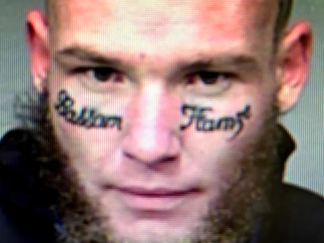 Arron Mathew Simmons has notorious Supermax inmate Bassam Hamzy's name incorrectly tattooed across his face and has been sentenced for firearms charges.