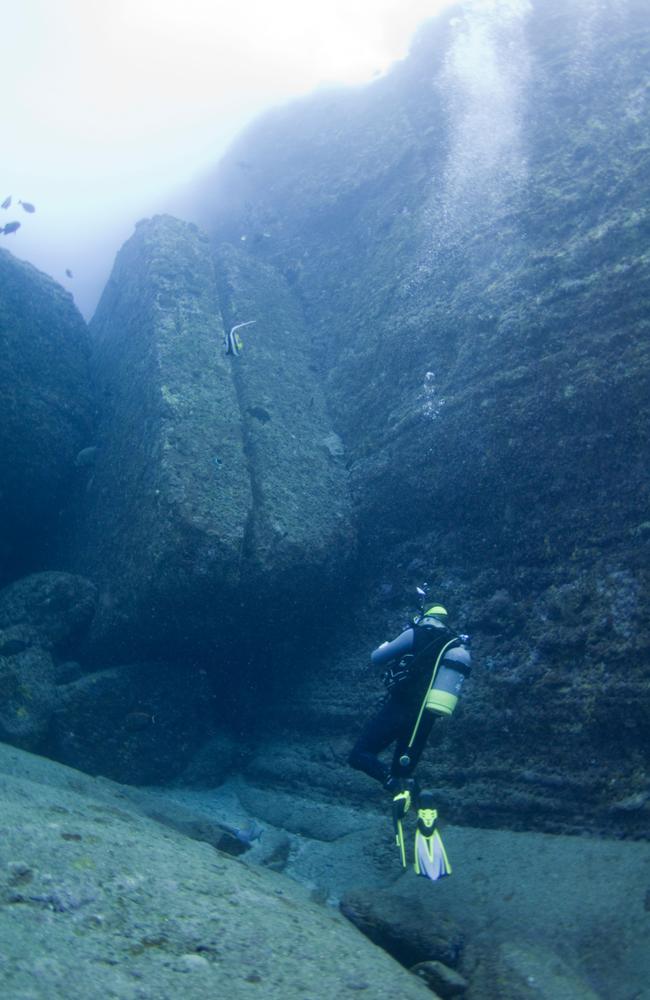 Some specialists argue that the Yonaguni Monument exhibits evident marks of human craftsmanship, such as carved steps, large stone structures, arches, and a face-like engraving in the rock. Picture: Alamy