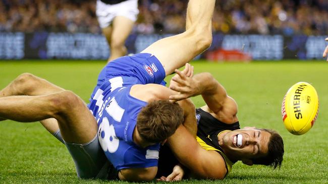 Alex Rance tangles with Mason Wood.