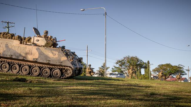 An Australian Army M113 Armoured Personnel Carrier with soldiers from the 3rd Battalion, Royal Australian Regiment, provide security during a simulated firefight in Ingham, Queensland, as part of Exercise Talisman Sabre 2021. Picture: Department of Defence