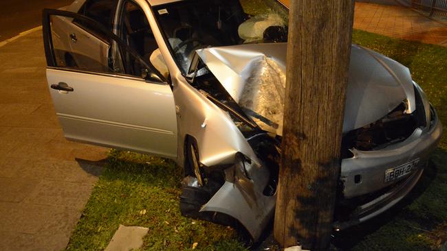 The Toyota Camry wrapped around a pole outside the Collegians club in Wollongong. Picture: Supplied