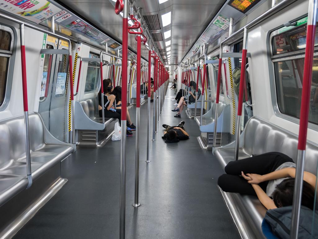Protesters occupy the train at the Laiking MTR Station during a protest to prevent commuters from reaching work. Picture: Getty Images