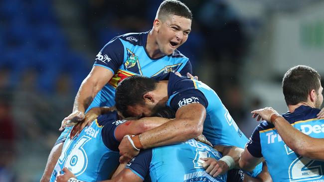 Ash Taylor celebrates after Konrad Hurrell of the Titans scores a try to win against Canberra . Picture: Chris Hyde/Getty Images