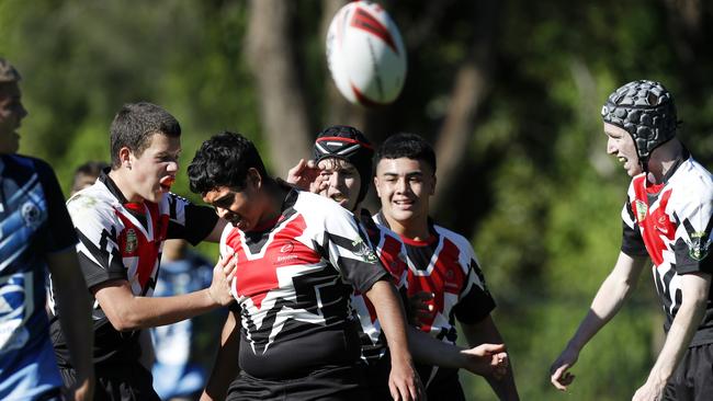 Deekon Parsons celebrates scoring a try with Erindale College teammates. Picture: Jonathan Ng