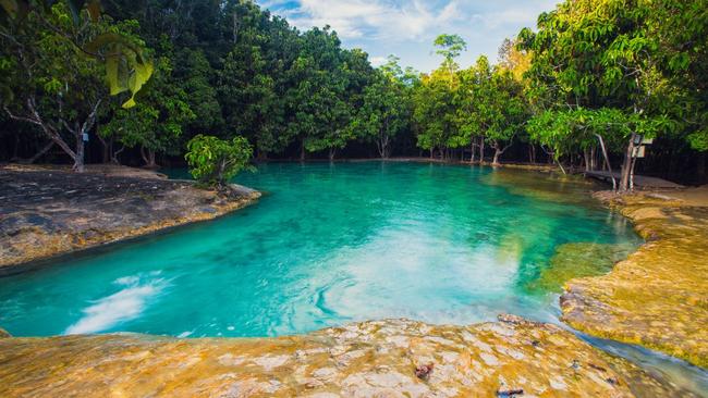 The striking emerald pool of Sa Kaeo, the deepest of its kind in Southeast Asia.
