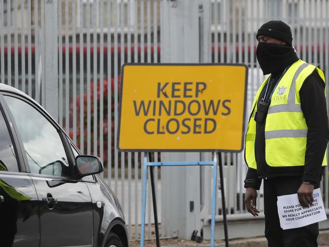 National Health Service staff wait in their cars to take a coronavirus test at a drive through centre in north London. Picture: AP