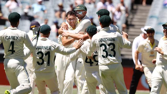 Scott Boland enjoys a wicket with teammates in the Boxing Day Test at the MCG in 2021. Photo by Michael Klein.