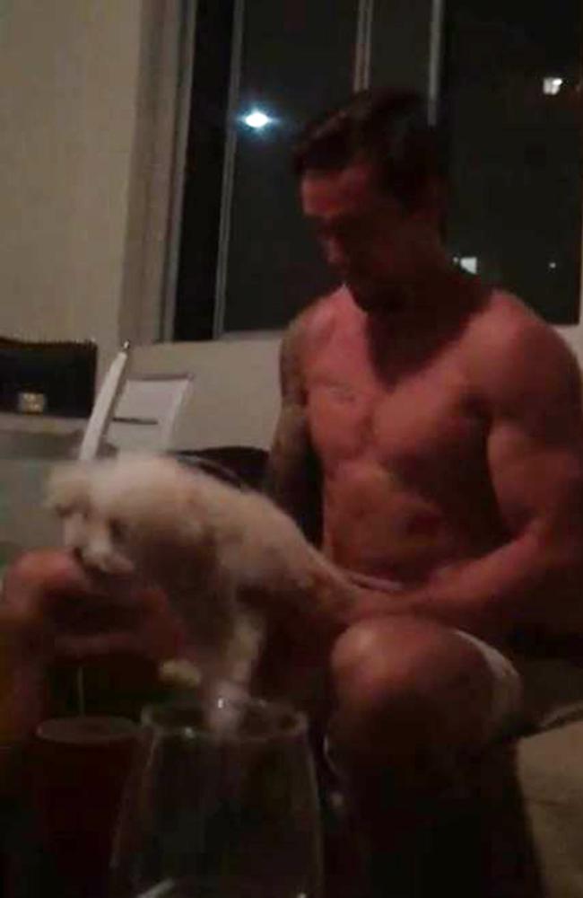 A frame from iPhone footage of Mitchell Pearce simulating a sexual act on a dog. Picture: DiiMEX