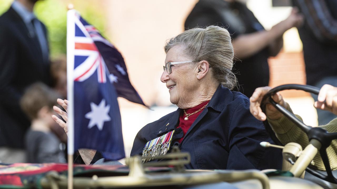 Jean Dellit waves from a Willys in the march to the Mothers' Memorial for the mid-morning Toowoomba Anzac Day service, Tuesday, April 25, 2023. Picture: Kevin Farmer