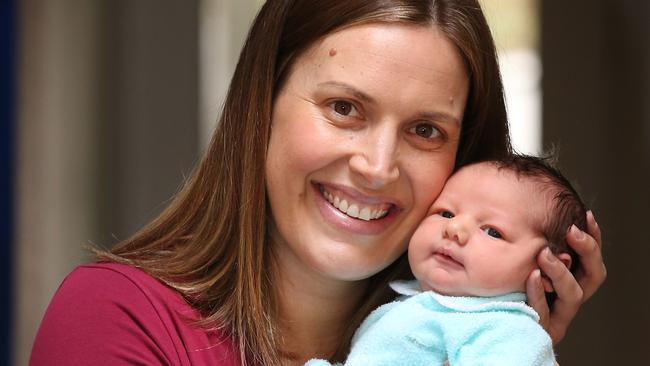 Sally Hasler, 35, with newborn baby daughter Nellie relax at home. Sally was 36 weeks pregnant when saw a man lying on the street unconscious. She did compressions until the ambulance arrived and saved the manÕs life.  Picture: David Caird