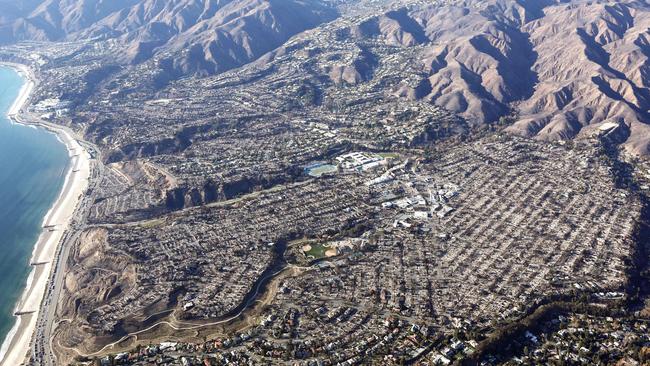 An aerial view of homes destroyed in the Palisades fire as wildfires cause damage and loss through the LA region on January 13 in Pacific Palisades, California. Picture: Mario Tama/Getty via AFP