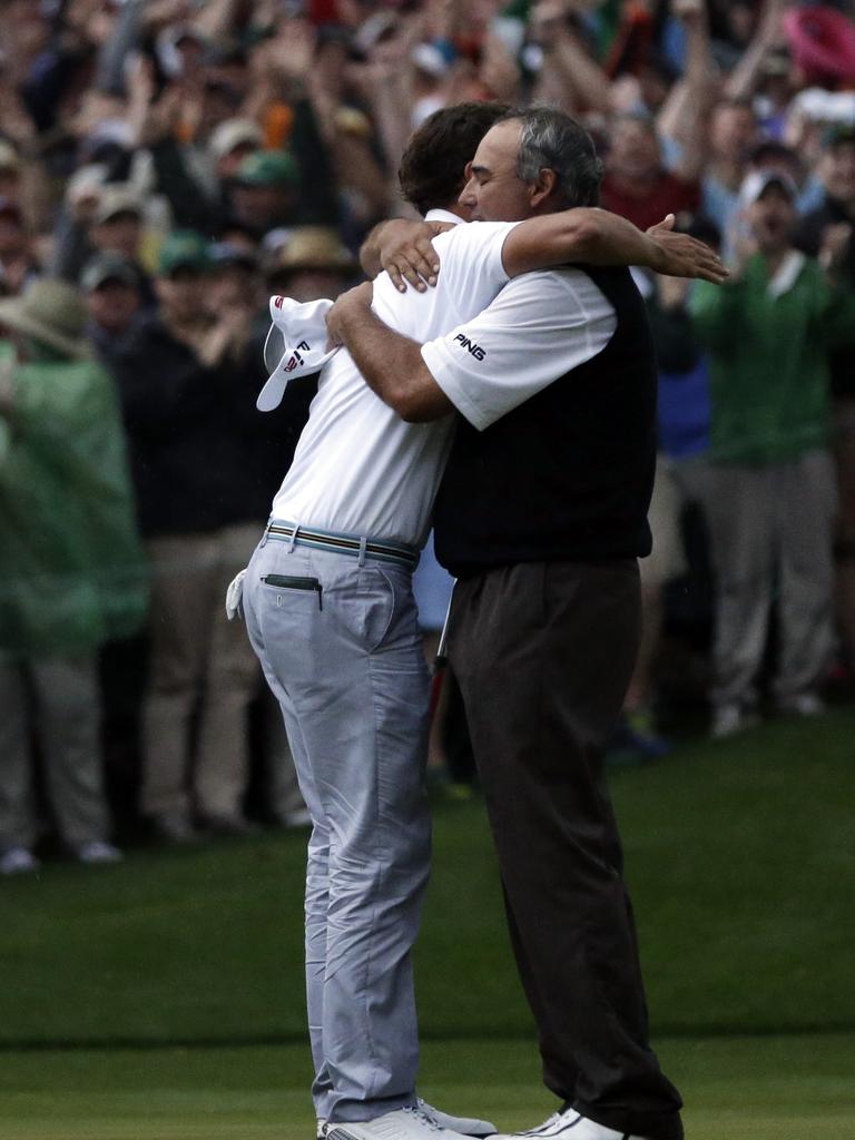 Adam Scott hugs Angel Cabrera after winning the Masters in a playoff. AP Photo/David J. Phillip.