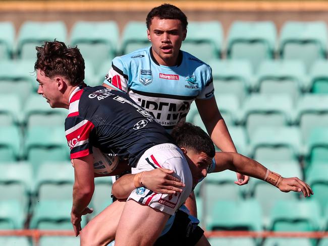 Rex Bassingthwaighte tackled by Spencer Swann. Picture: Adam Wrightson Photography.