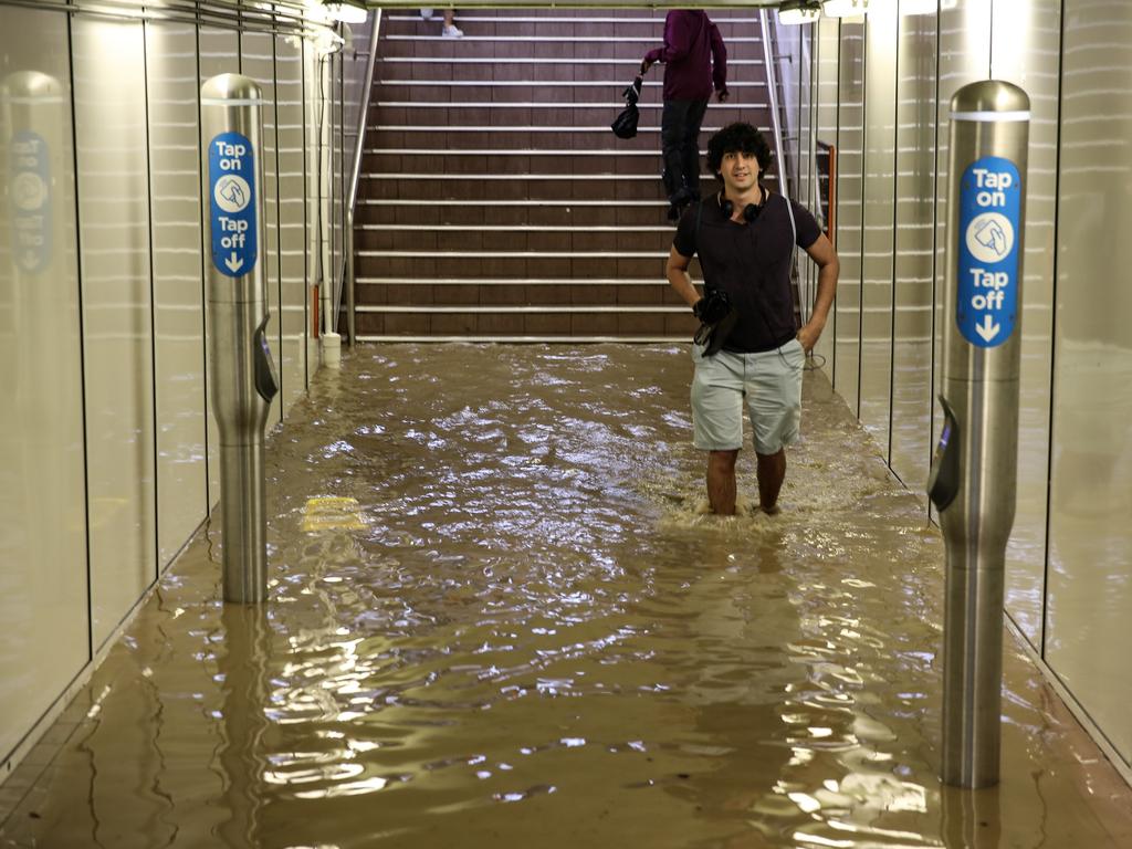 Commuters struggle against torrential rain and gale force winds in Lewisham as Sydney is lashed with a monumental early summer storm, 28/11/18. Picture: Nicholas Eagar