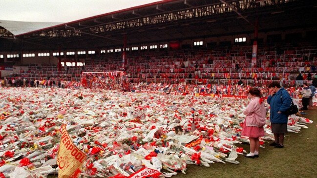 Tributes lie on the pitch at Anfield stadium pitch in memory of the 96 fans who died in at Hillsborough.