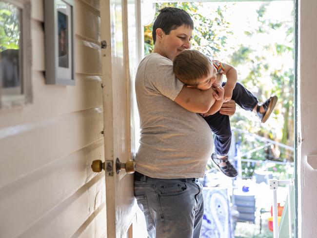 Roy, 38, pictured 28 weeks’ pregnant, at his Brisbane home with his son Jack, 18 months. Picture: Mark Cranitch.