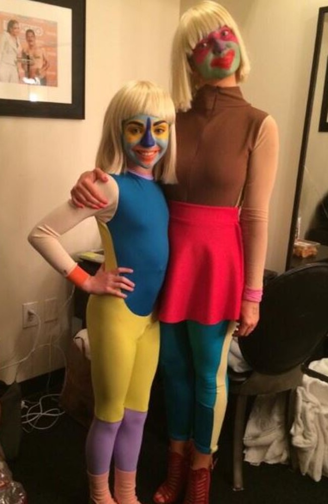 Covering up: Maddie Ziegler and Sia Furler backstage at Jimmy Kimmel Live in 2014.