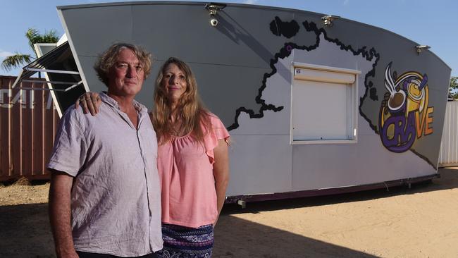 Owners of Crave NT Rod Cole and Kimdelia Cole stand in front of their portable cafe. The Coles removed their cafe from Darwin Airport Entertainment Precinct via crane following lease conflicts. Picture: Keri Megelus