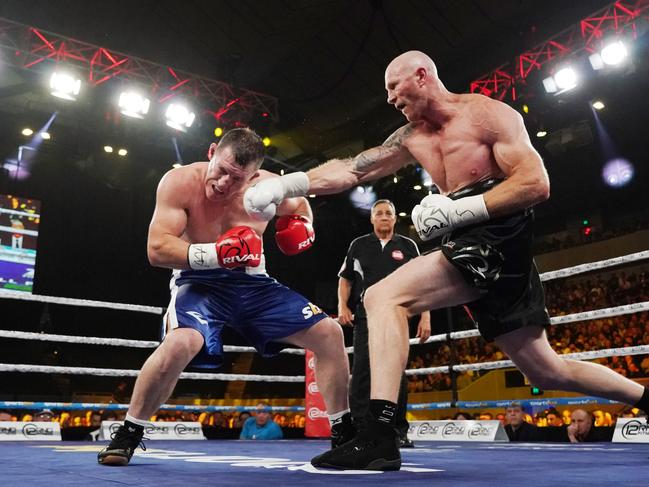 Barry Hall nails Paul Gallen during the Code War Boxing night at Margaret Court Arena in Melbourne. (AAP Image/Michael Dodge)